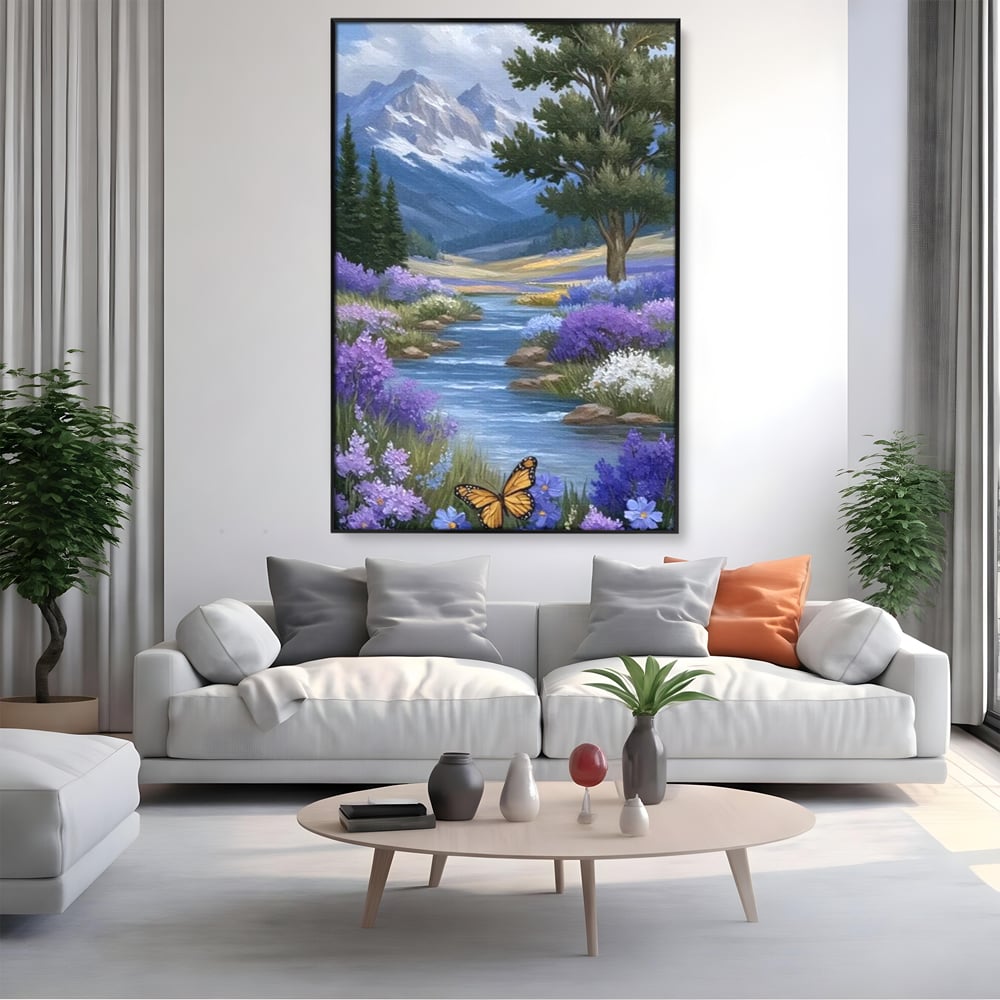 Tablou canvas cu tablou pictura peisaj montan cu rau si flori, in rama de aluminiu negru, pe perete intr-un living