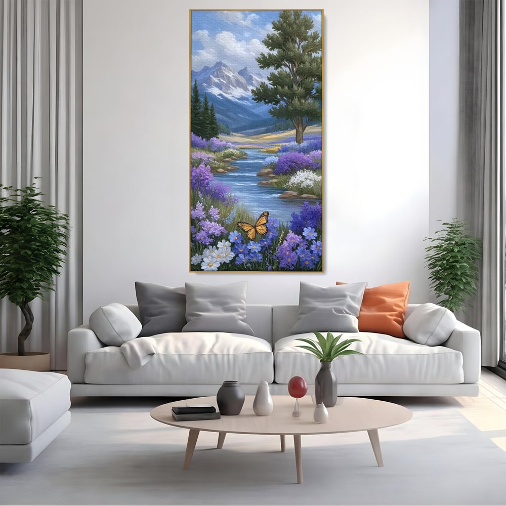 Tablou canvas cu tablou pictura peisaj montan cu rau si flori, in rama de aluminiu auriu, pe perete intr-un living