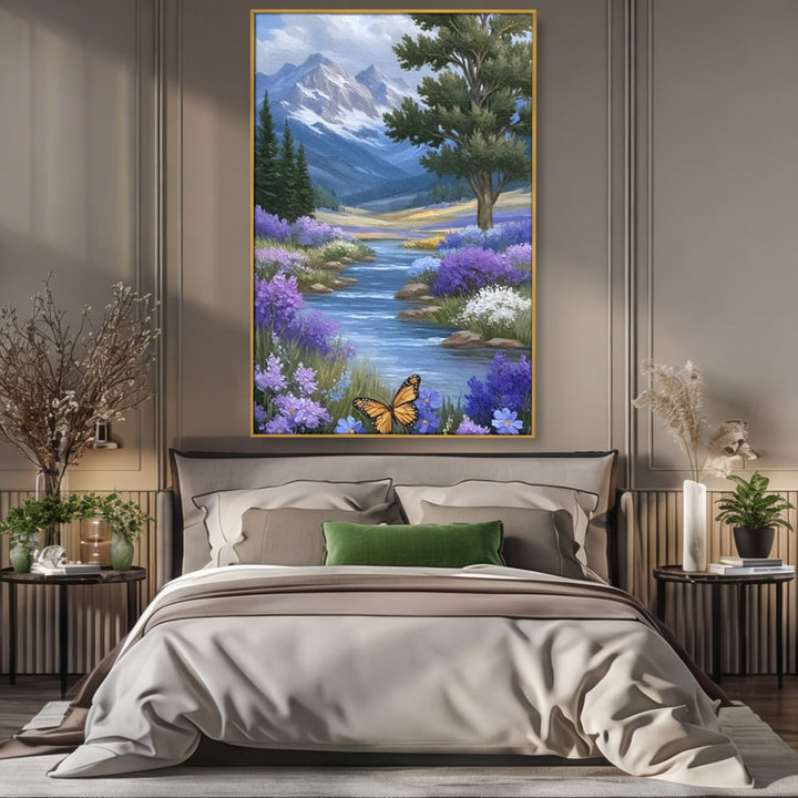 Tablou canvas cu tablou pictura peisaj montan cu rau si flori, in rama de aluminiu auriu, pe perete intr-un dormitor