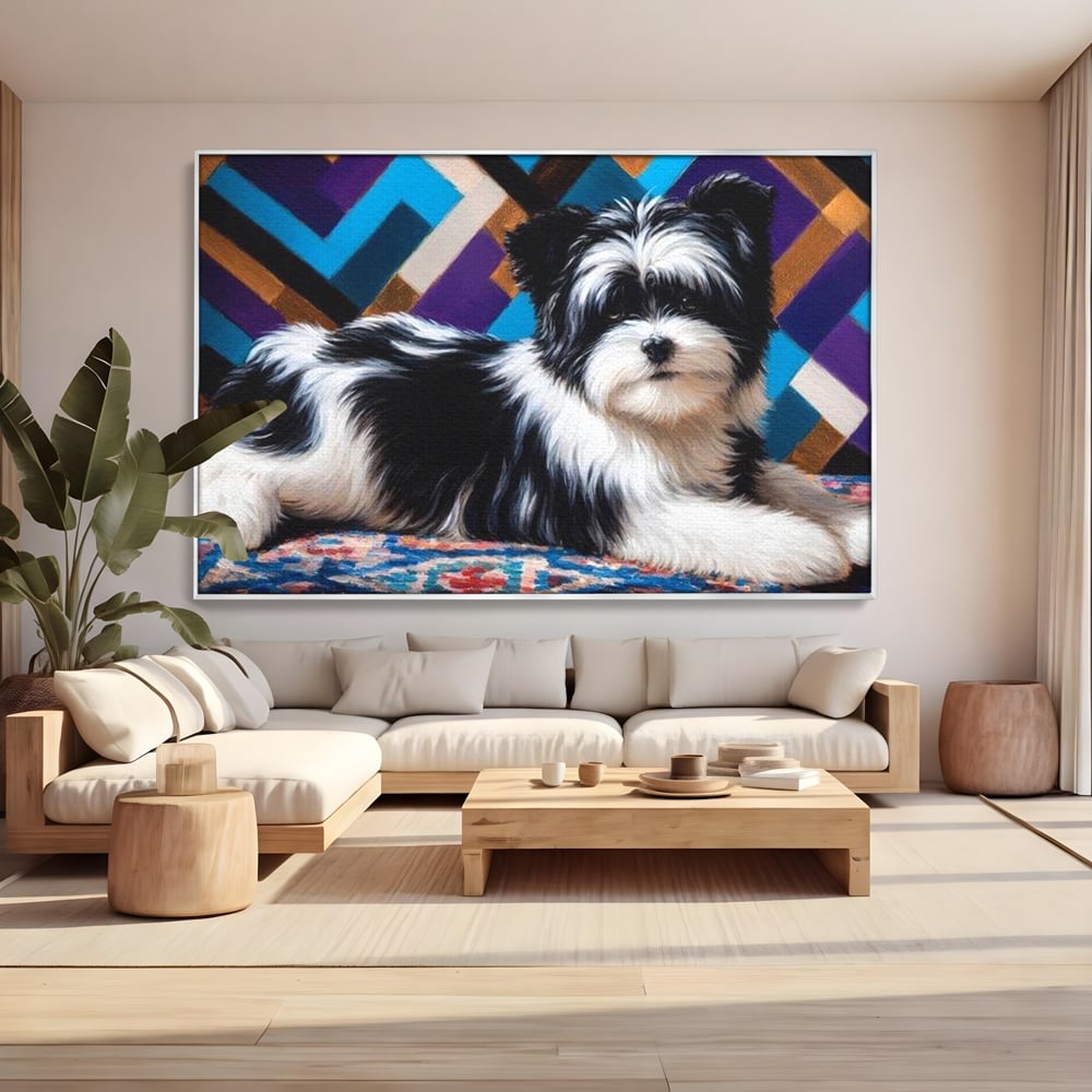 Tablou canvas cu tablou canvas cu catel pufos alb-negru, in rama de aluminiu argintiu, pe perete intr-un living