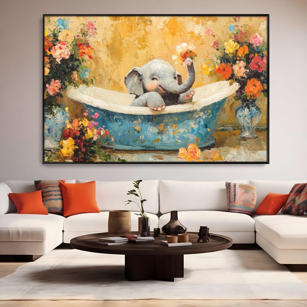 Tablou canvas cu tablou canvas cu pui de elefant in cada, in rama de aluminiu negru, pe perete intr-un living