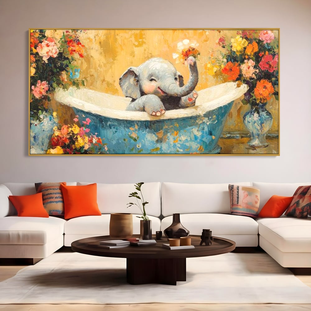 Tablou canvas cu tablou canvas cu pui de elefant in cada, in rama de aluminiu auriu, pe perete intr-un living