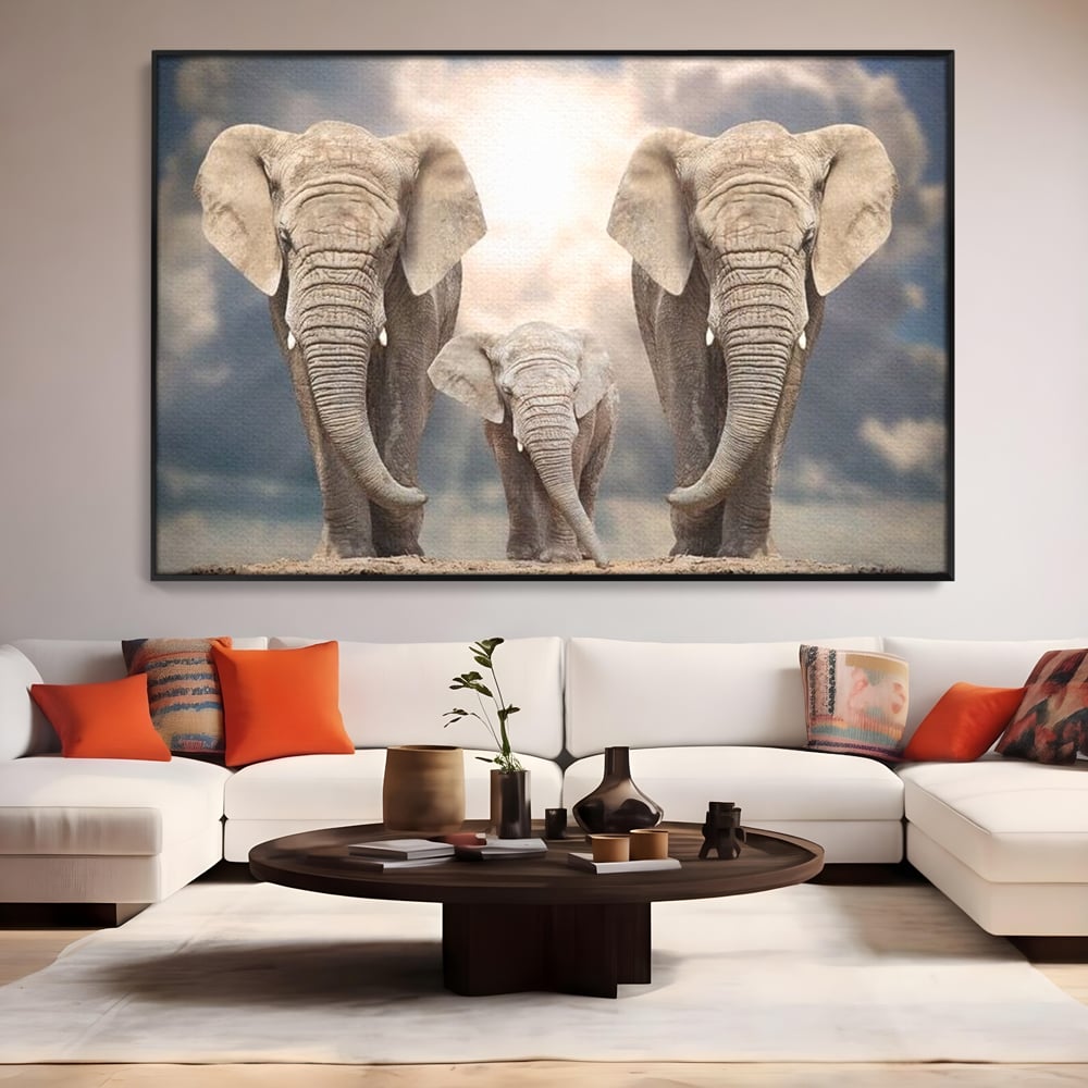 Tablou canvas cu tablou canvas cu trei elefanti, in rama de aluminiu negru, pe perete intr-un living