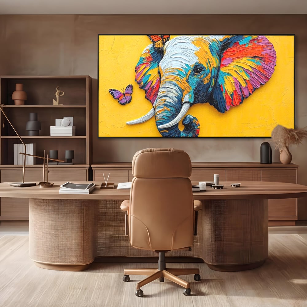 Tablou canvas cu tablou canvas cu elefant colorat si fluturi, in rama de aluminiu negru, pe perete intr-un birou