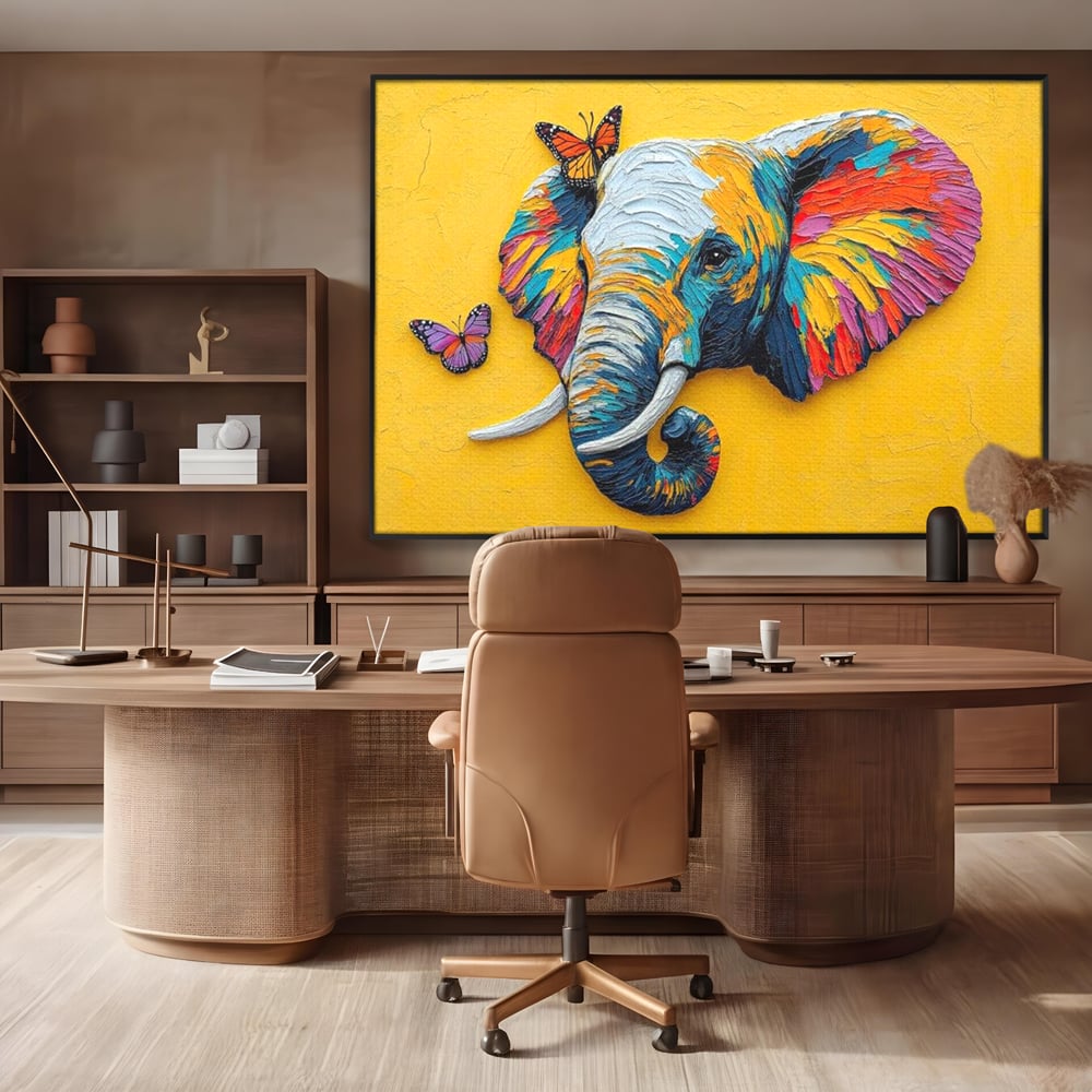 Tablou canvas cu tablou canvas cu elefant colorat si fluturi, in rama de aluminiu negru, pe perete intr-un birou