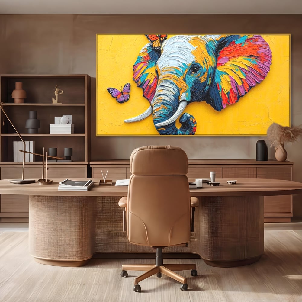 Tablou canvas cu tablou canvas cu elefant colorat si fluturi, in rama de aluminiu auriu, pe perete intr-un birou