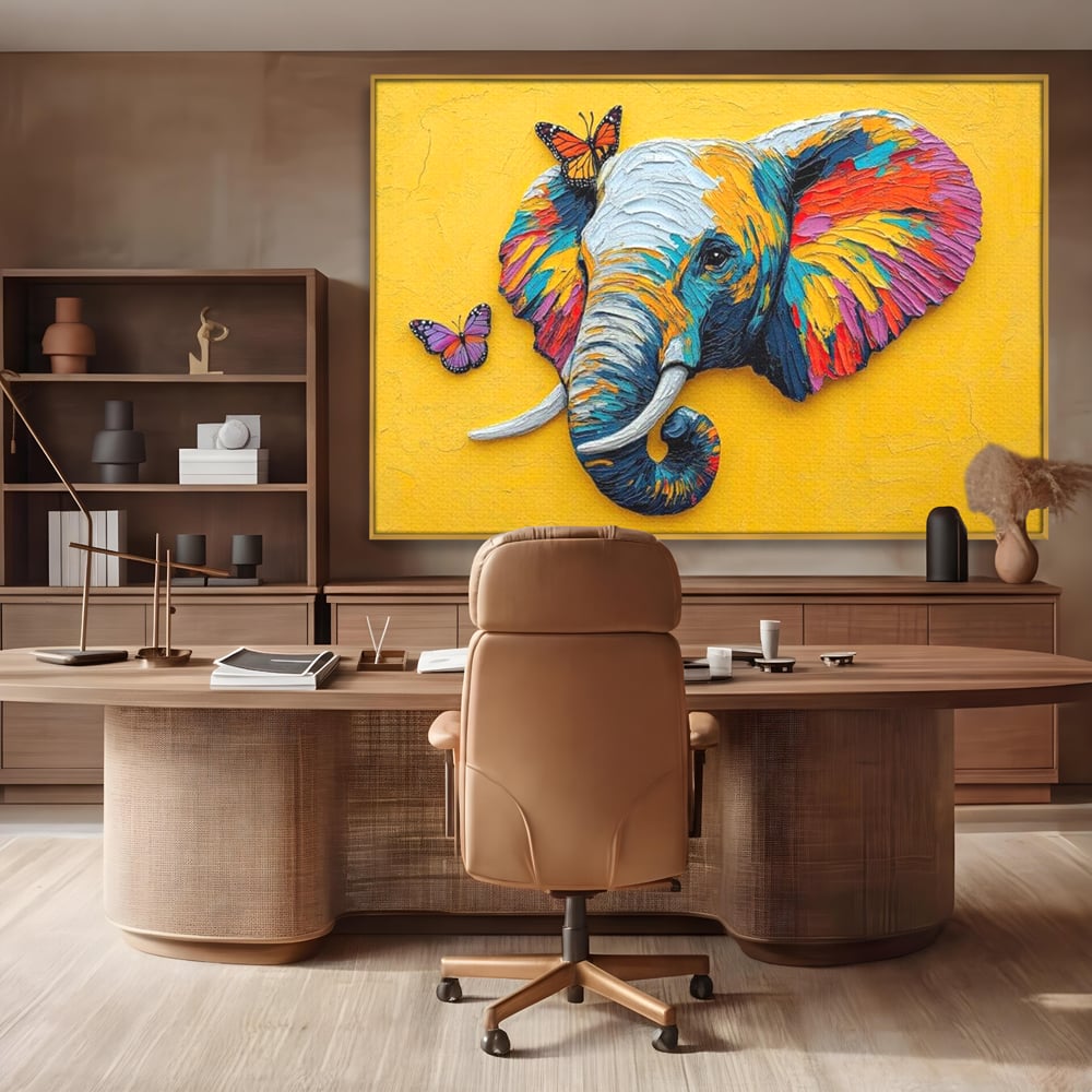 Tablou canvas cu tablou canvas cu elefant colorat si fluturi, in rama de aluminiu auriu, pe perete intr-un birou