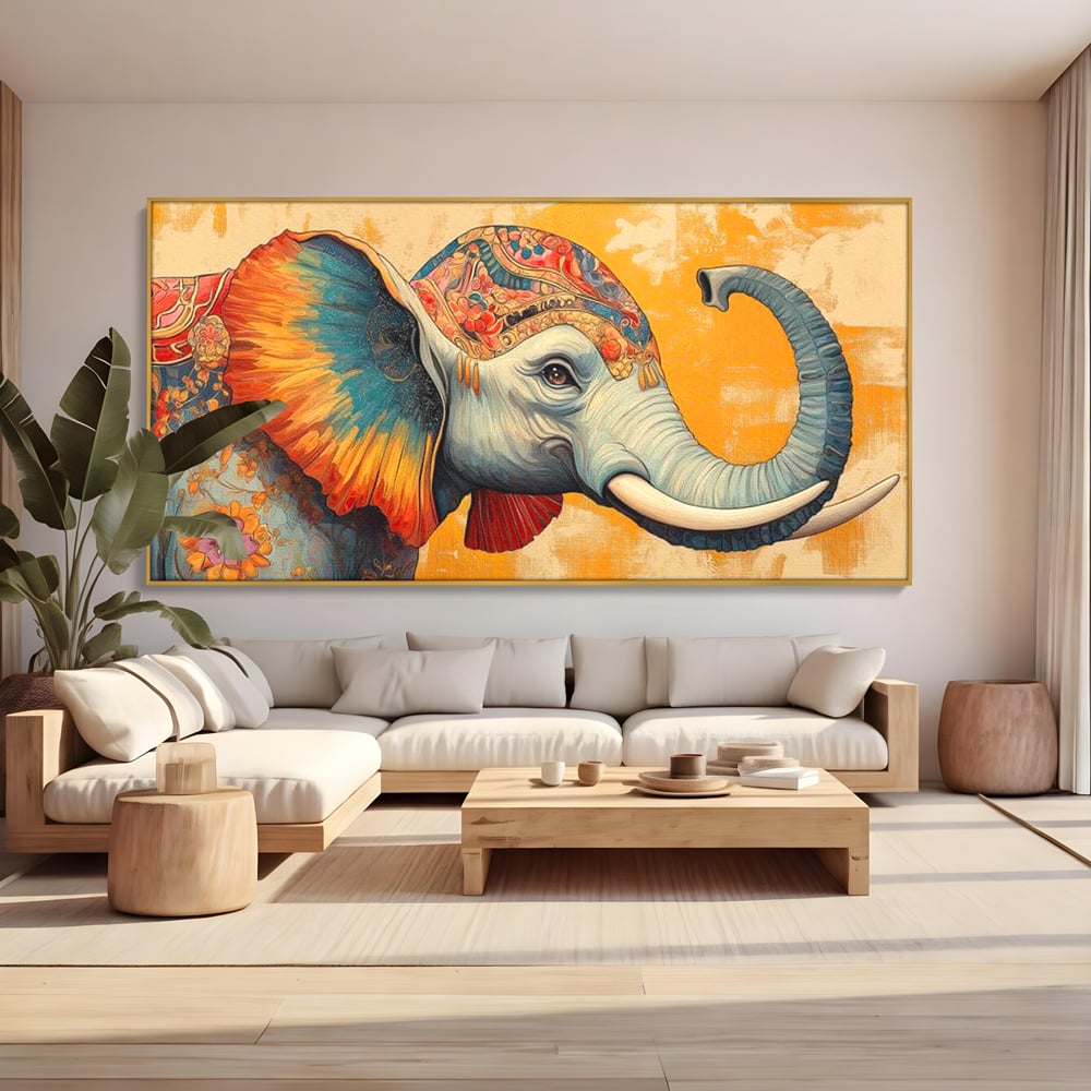 Tablou canvas cu tablou canvas cu elefant decorat in stil oriental, in rama de aluminiu auriu, pe perete intr-un living