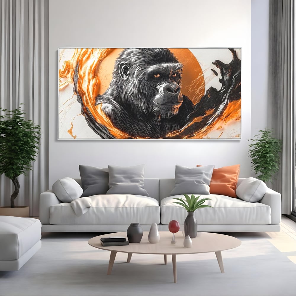 Tablou canvas cu tablou canvas cu gorila si cerc de foc, in rama de aluminiu argintiu, pe perete intr-un living