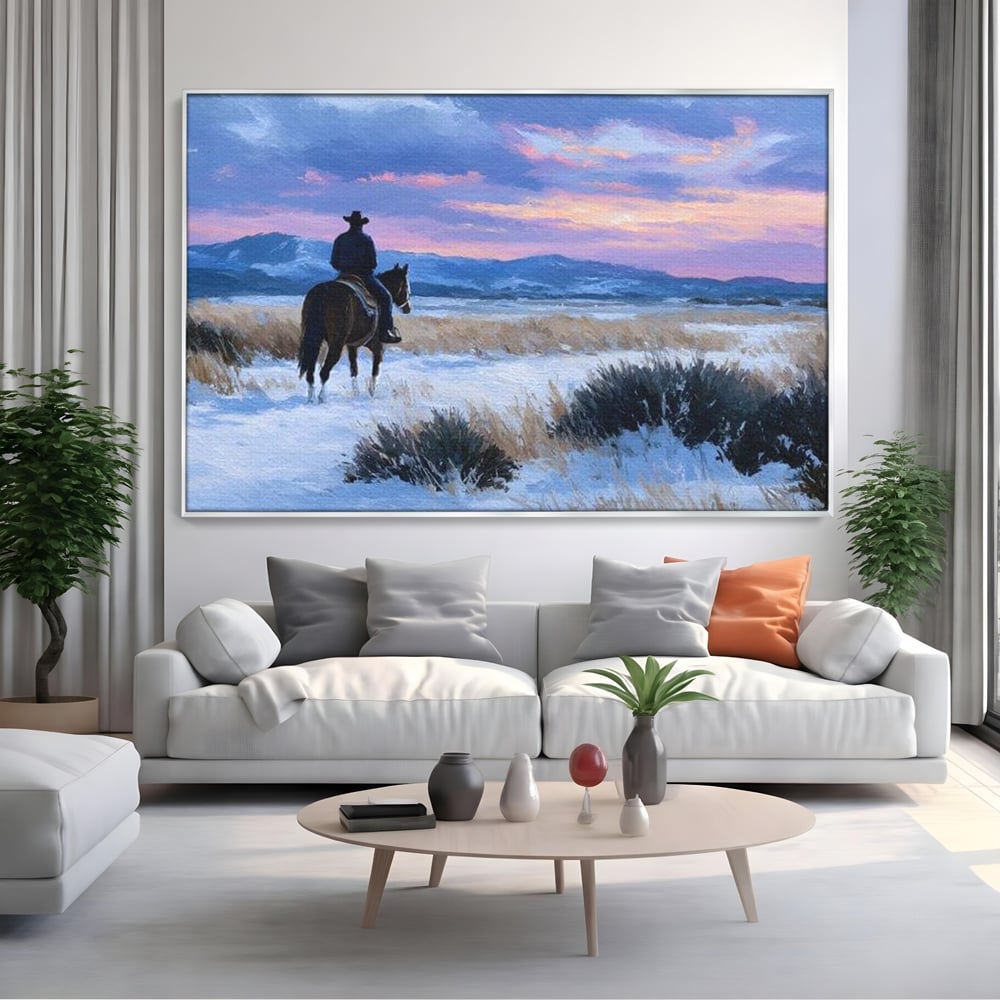 Tablou canvas cu pictura cu calaret cowboy in zapada, in rama de aluminiu argintiu, pe perete intr-un living
