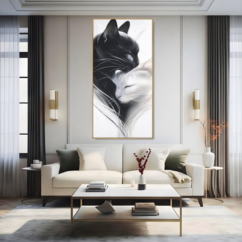 Tablou canvas cu tablou canvas cu pisici alb si negru, in rama de aluminiu auriu, pe perete intr-un living
