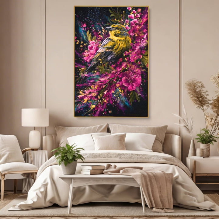 Tablou canvas cu tablou canvas cu pasare printre flori, in rama de aluminiu auriu, pe perete intr-un dormitor