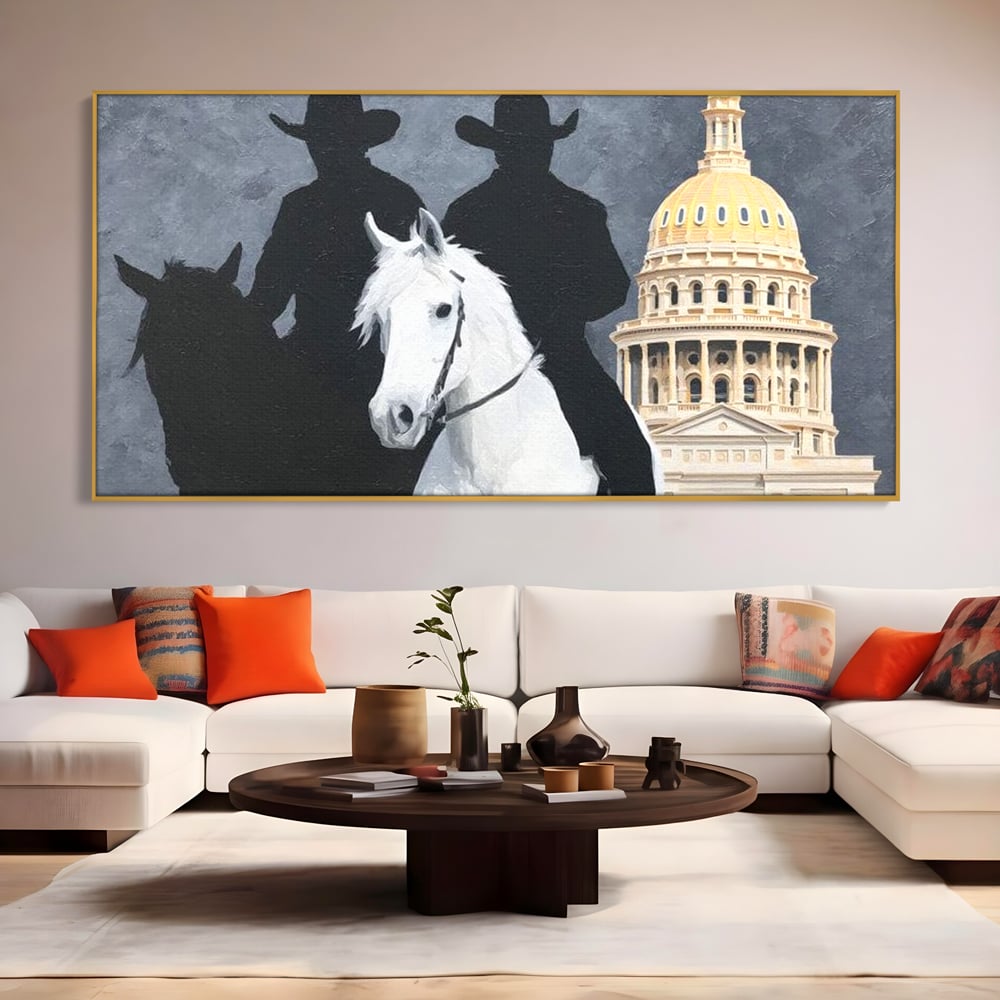 Tablou canvas cu pictura cu doi cowboy si cladire oficiala, in rama de aluminiu auriu, pe perete intr-un living