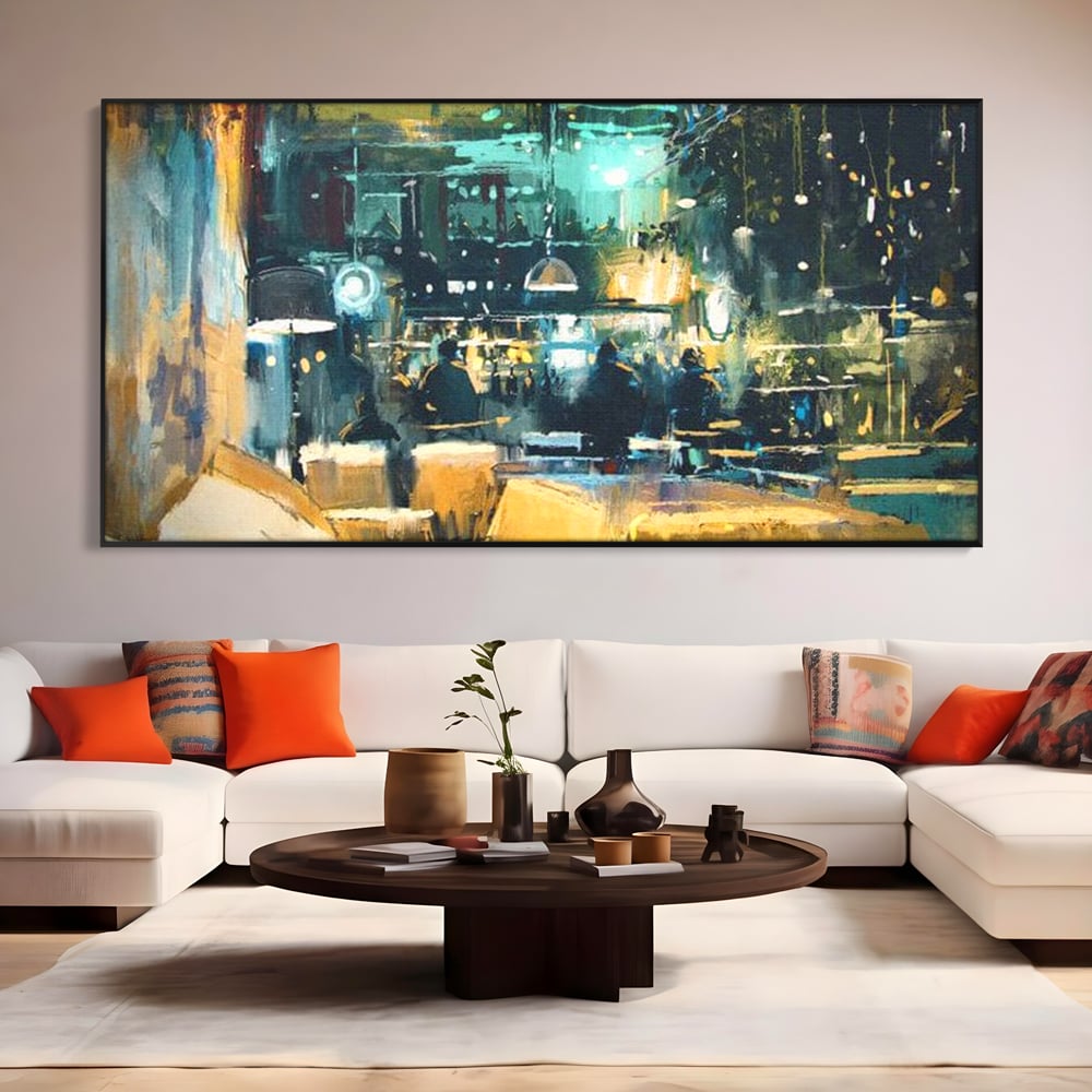 Tablou canvas cu pictura urbana cu pub luminat noaptea, in rama de aluminiu negru, pe perete intr-un living