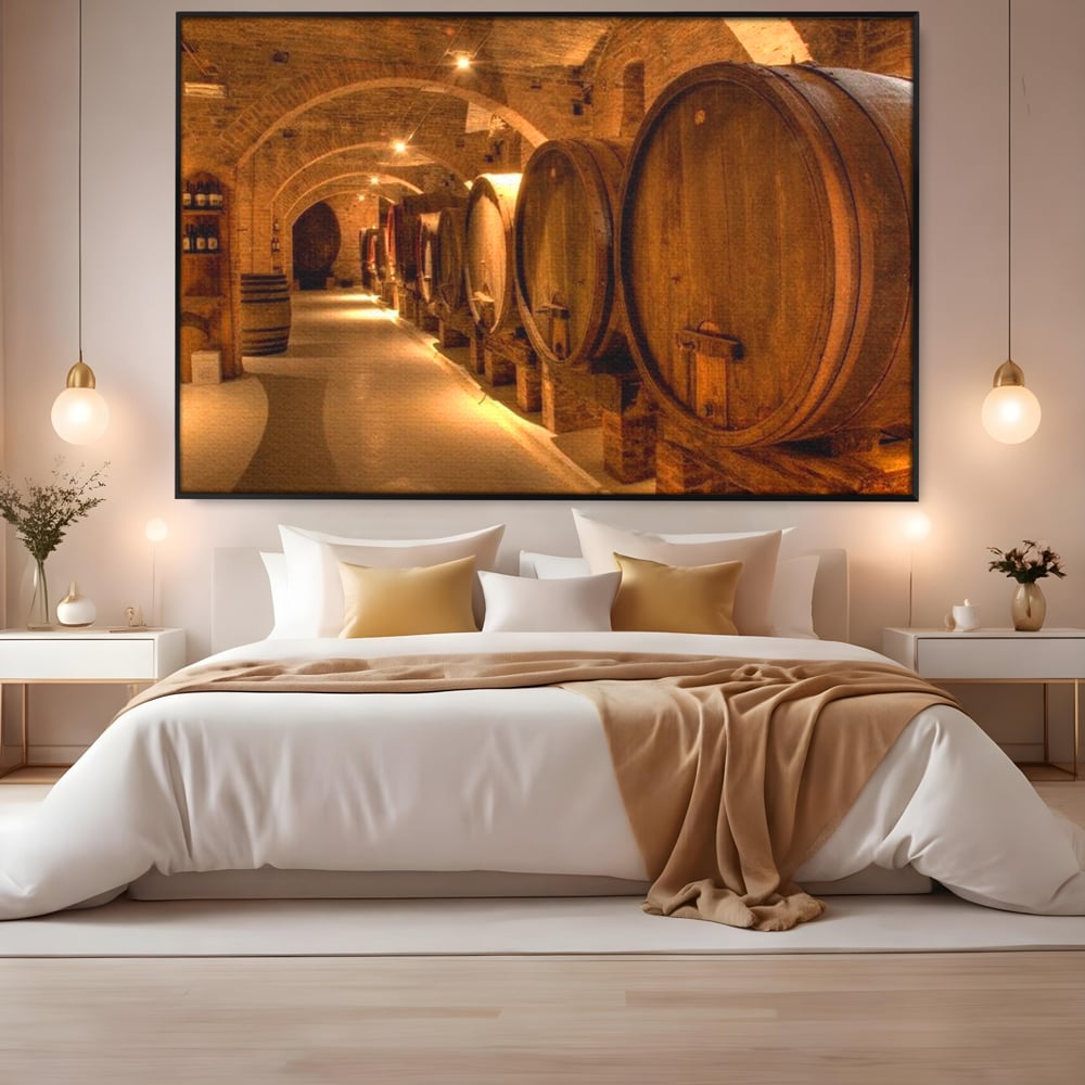 Tablou canvas cu tablou canvas cu butoaie de vin in crama, in rama de aluminiu negru, pe perete intr-un dormitor