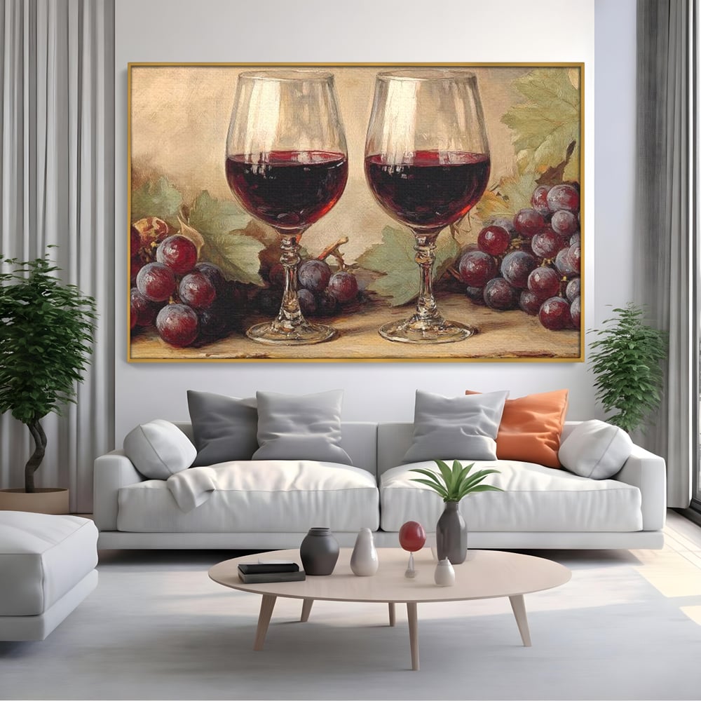 Tablou canvas cu pictura cu doua pahare de vin rosu, in rama de aluminiu auriu, pe perete intr-un living