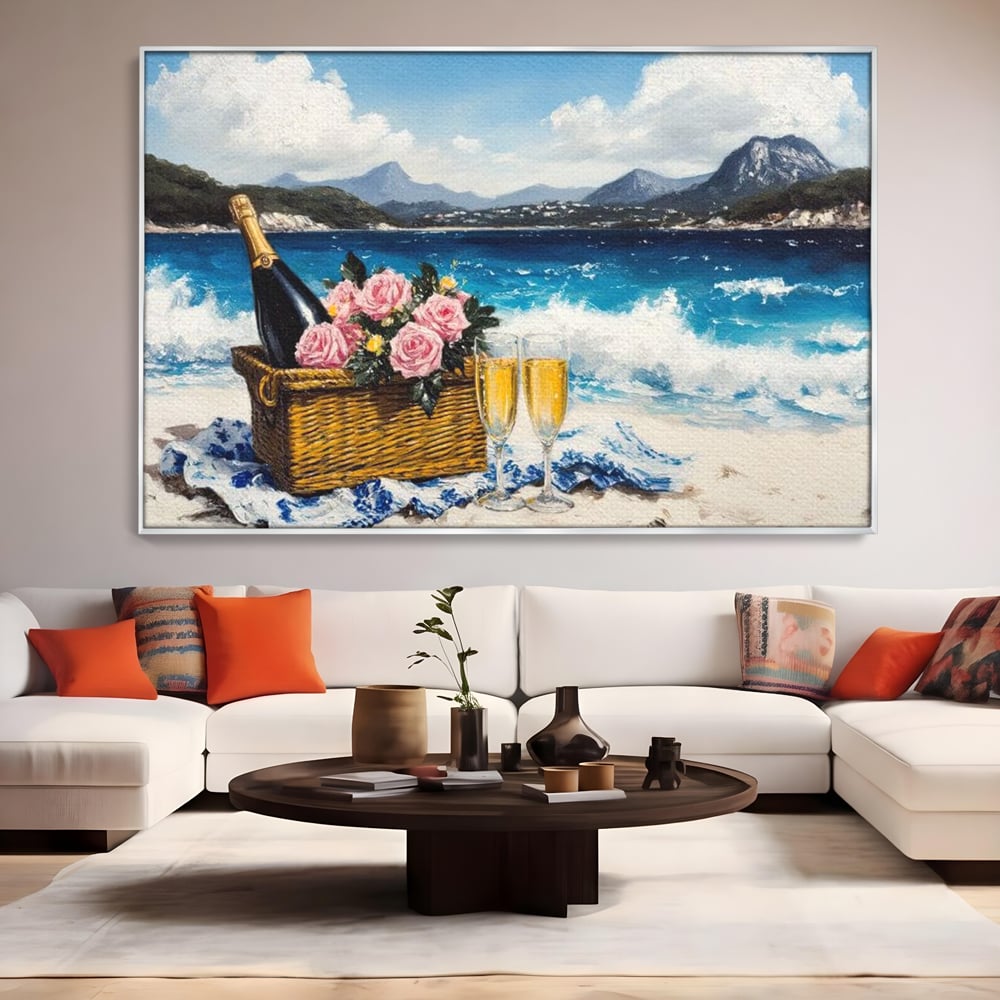Tablou canvas cu pictura cu picnic pe plaja cu sampanie, in rama de aluminiu argintiu, pe perete intr-un living