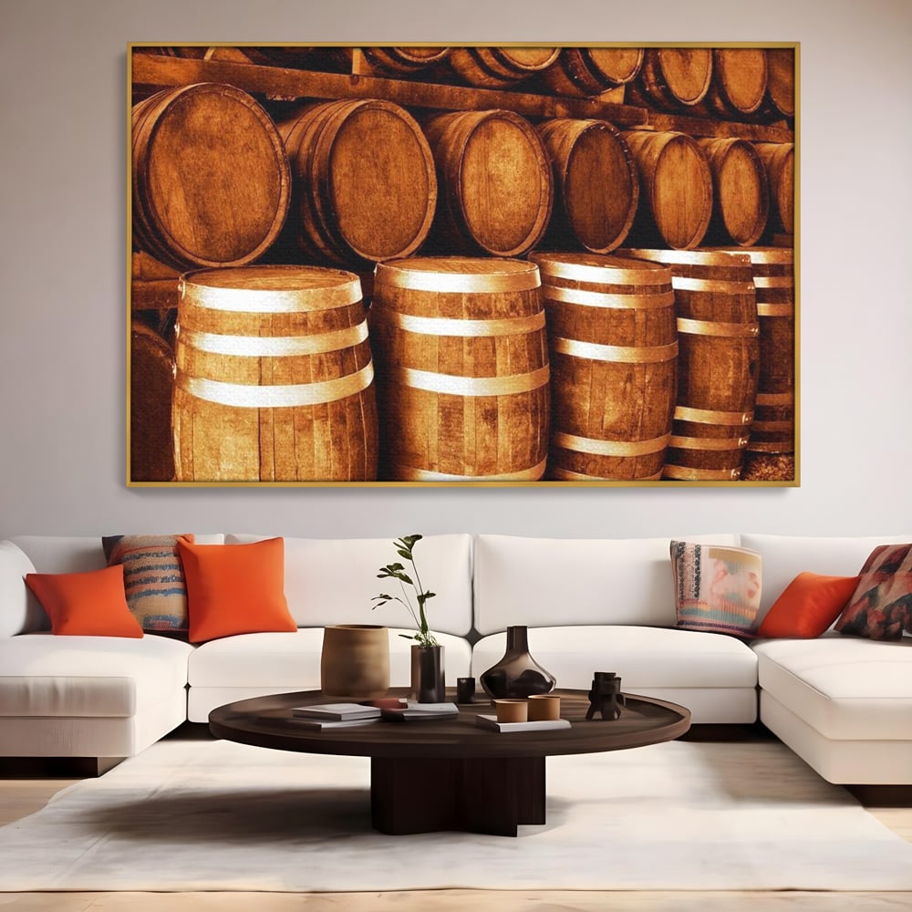 Tablou canvas cu tablou canvas cu butoaie din lemn, in rama de aluminiu auriu, pe perete intr-un living
