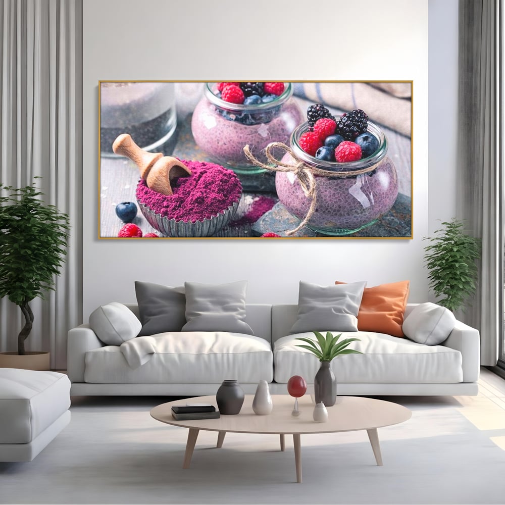 Tablou canvas cu natura moarta cu desert si fructe de padure, in rama de aluminiu auriu, pe perete intr-un living