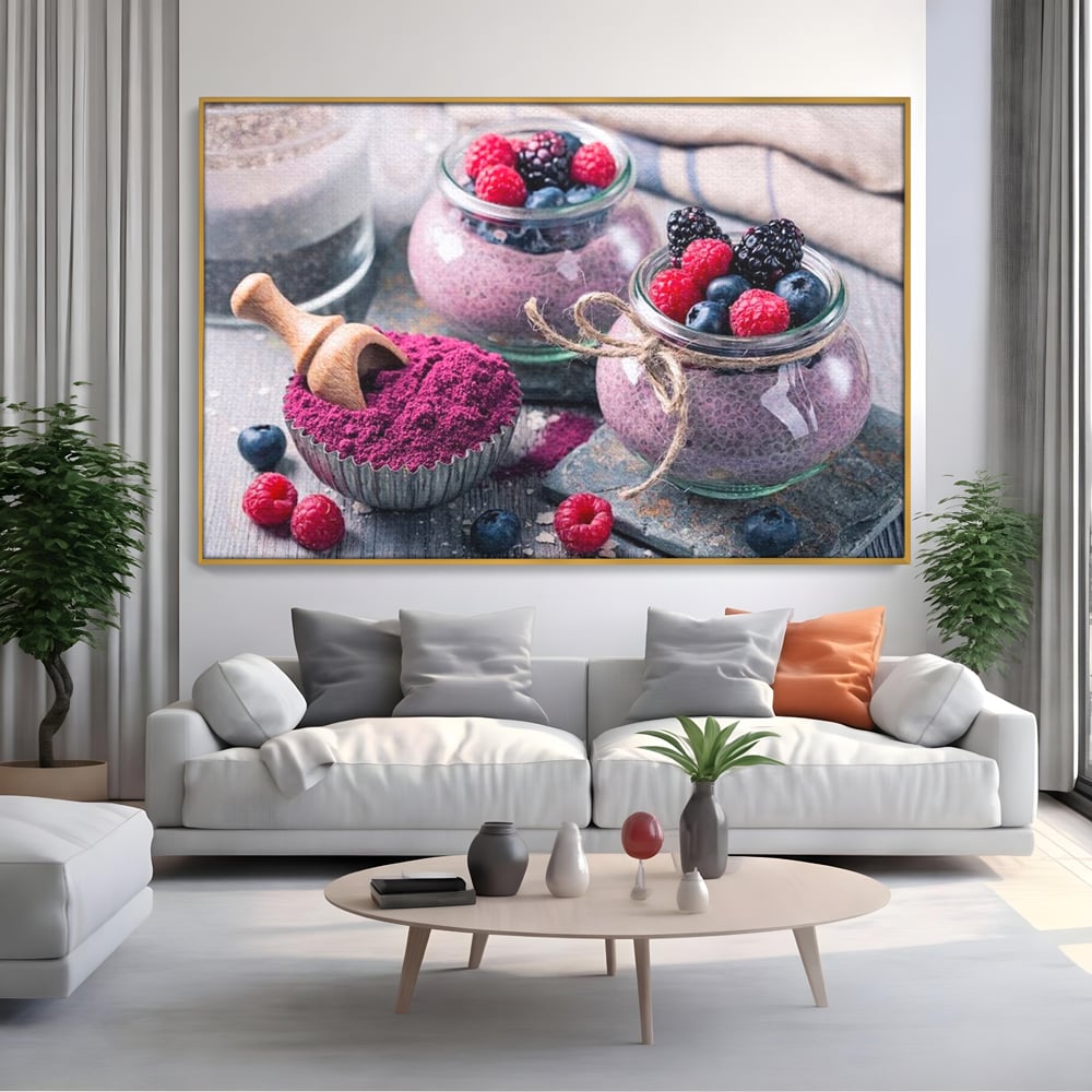 Tablou canvas cu natura moarta cu desert si fructe de padure, in rama de aluminiu auriu, pe perete intr-un living