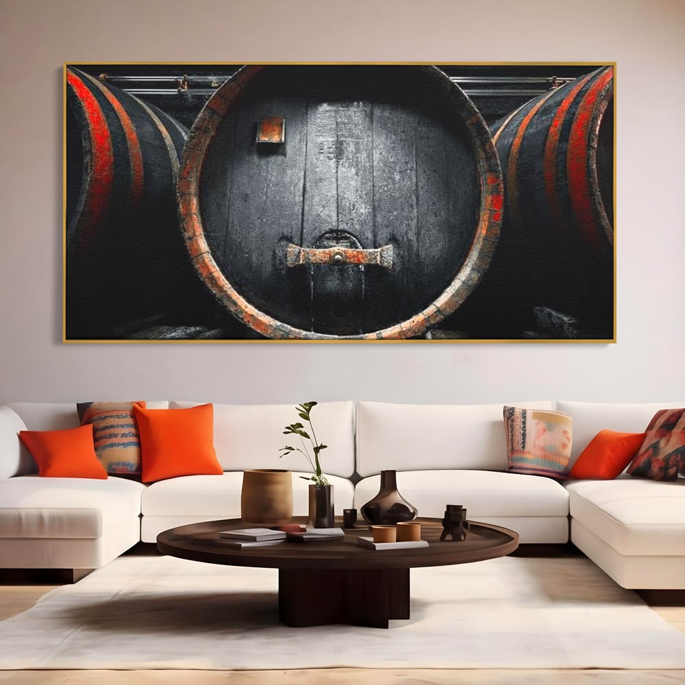 Tablou canvas cu butoaie de lemn din crama, in rama de aluminiu auriu, pe perete intr-un living