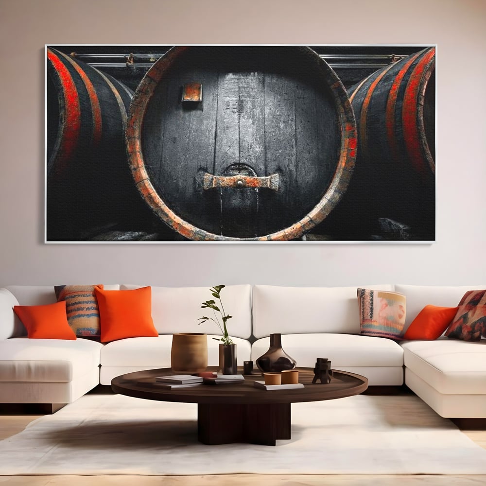 Tablou canvas cu butoaie de lemn din crama, in rama de aluminiu argintiu, pe perete intr-un living