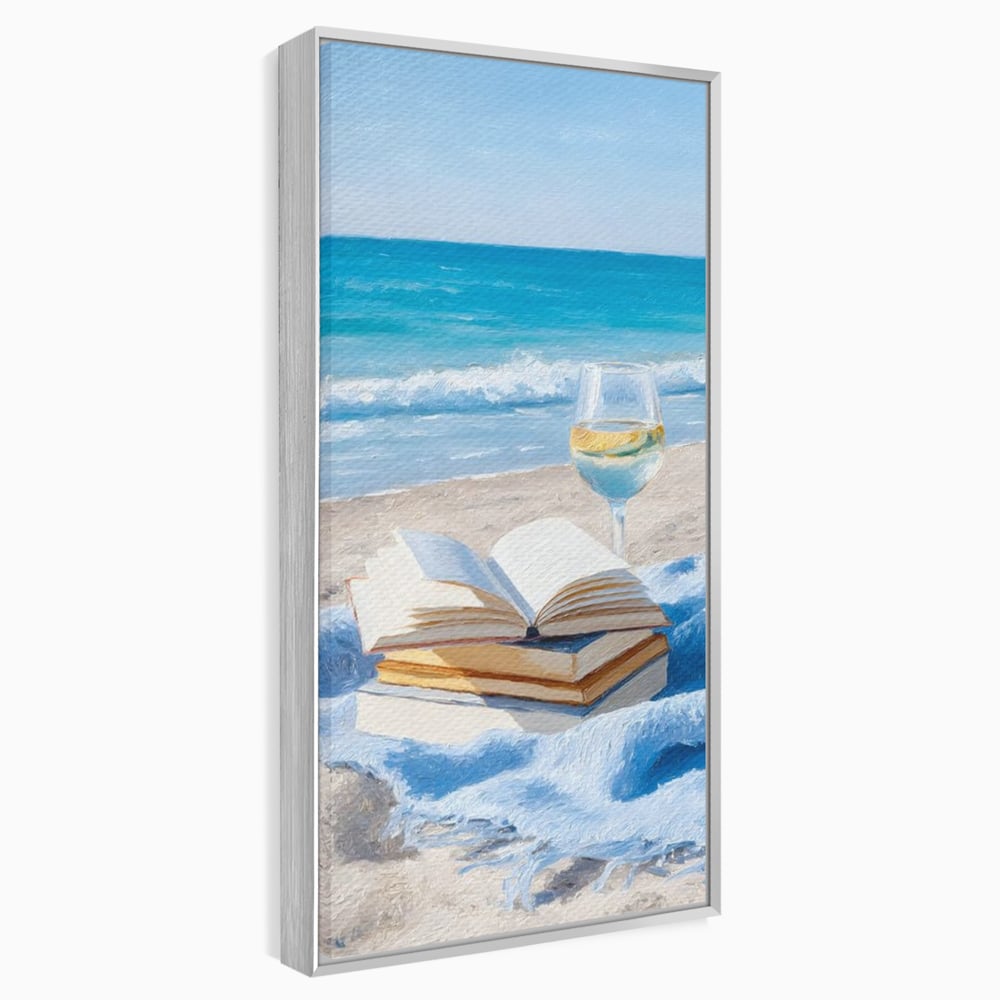 Tablou canvas cu pictura cu carti si pahar de vin pe plaja, in rama de aluminiu argintiu