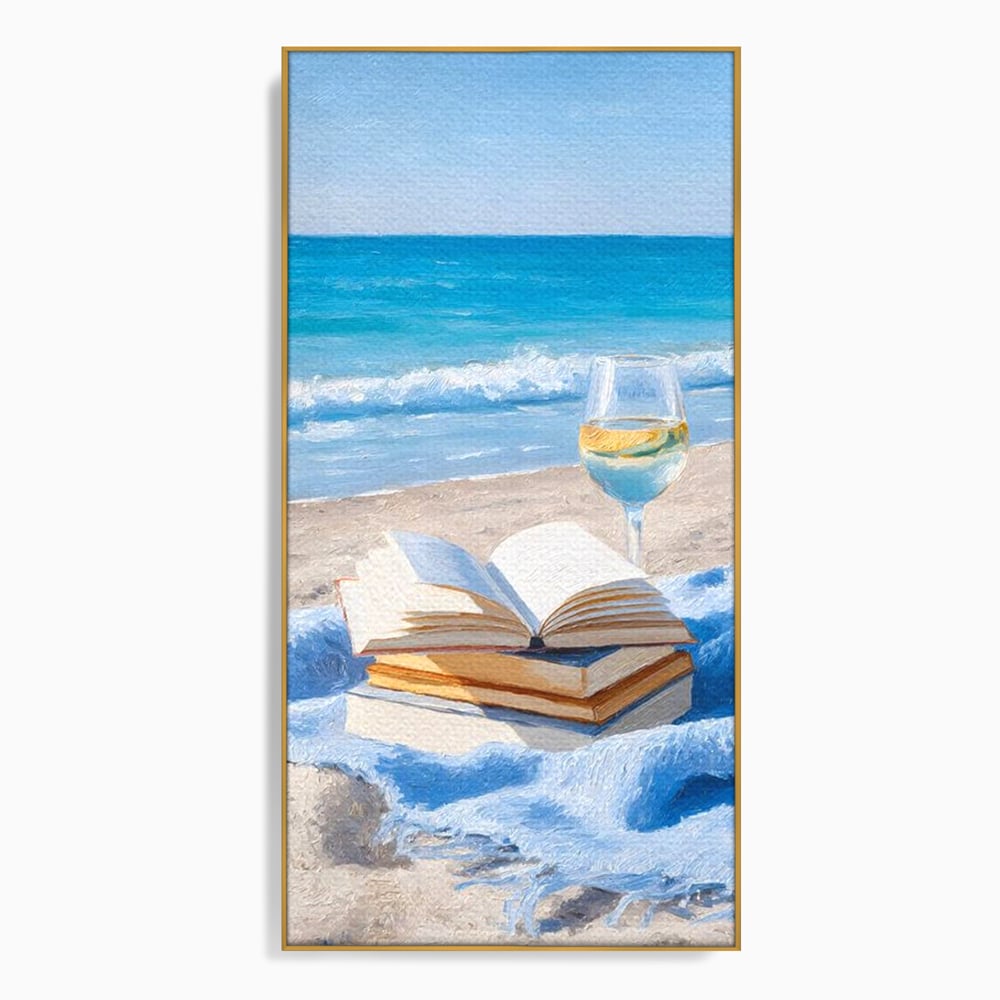 Tablou canvas cu pictura cu carti si pahar de vin pe plaja, in rama de aluminiu auriu