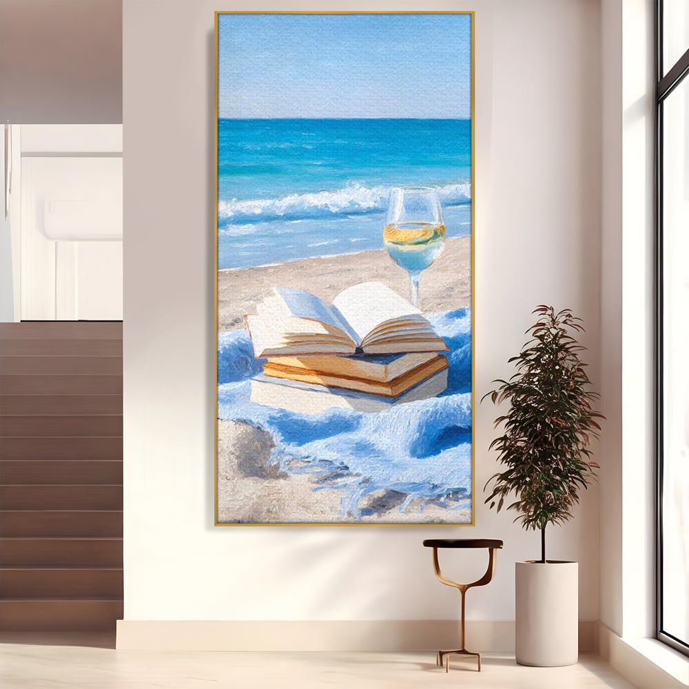 Tablou canvas cu pictura cu carti si pahar de vin pe plaja, in rama de aluminiu auriu