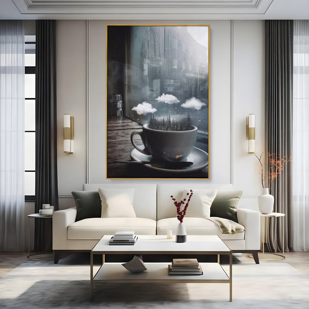Tablou canvas cu ceasca de cafea cu padure si nori, in rama de aluminiu auriu, pe perete intr-un living