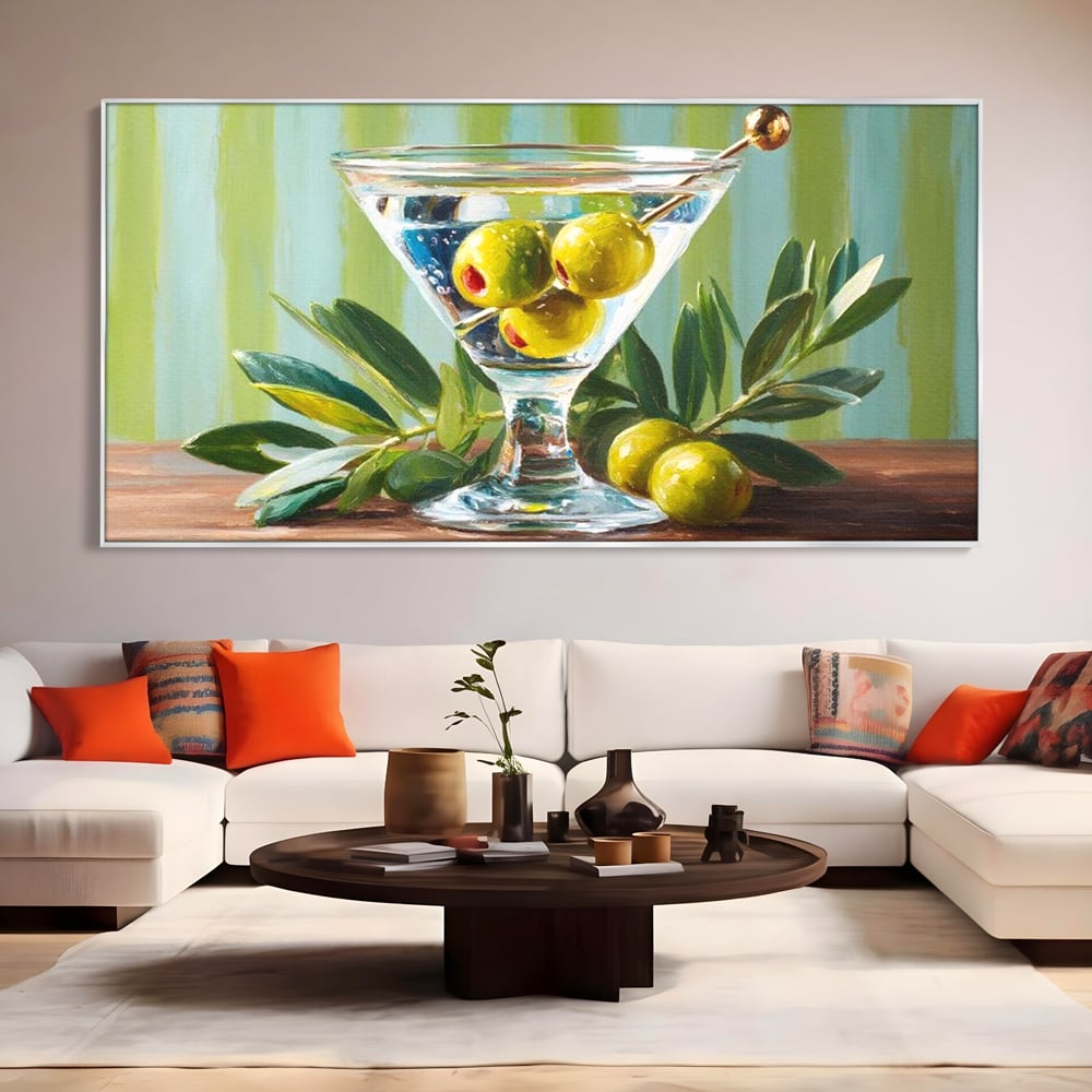 Tablou canvas cu pictura cu pahar martini si masline, in rama de aluminiu argintiu, pe perete intr-un living