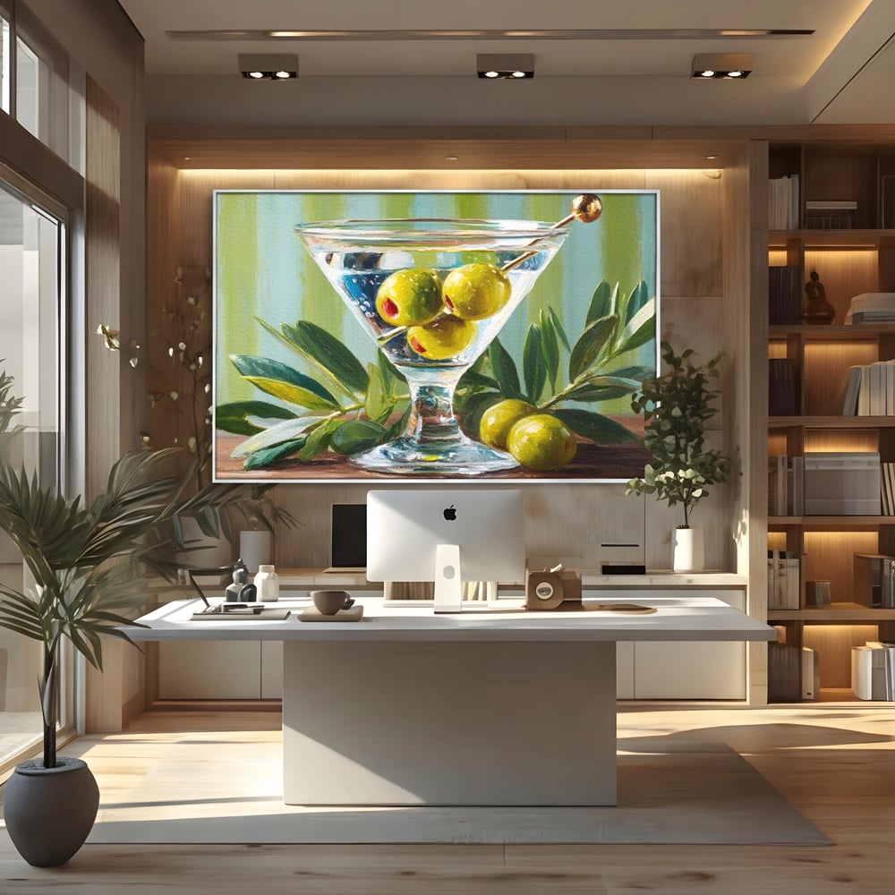 Tablou canvas cu pictura cu pahar martini si masline, in rama de aluminiu argintiu, pe perete intr-un birou
