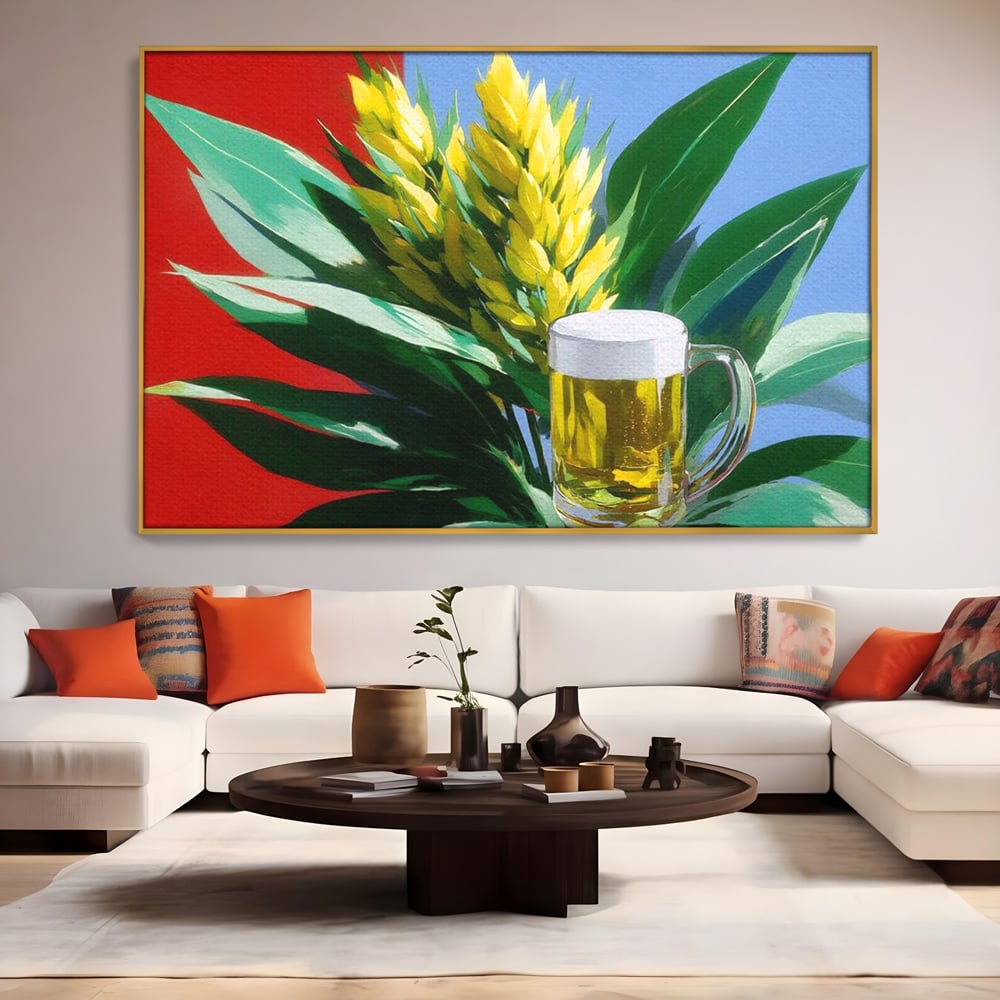 Tablou canvas cu tablou canvas cu halba de bere si frunze tropicale, in rama de aluminiu auriu, pe perete intr-un living