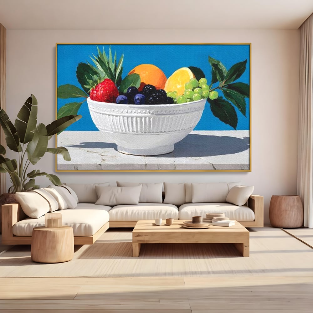 Tablou canvas cu pictura cu bol alb si fructe, in rama de aluminiu auriu, pe perete intr-un living