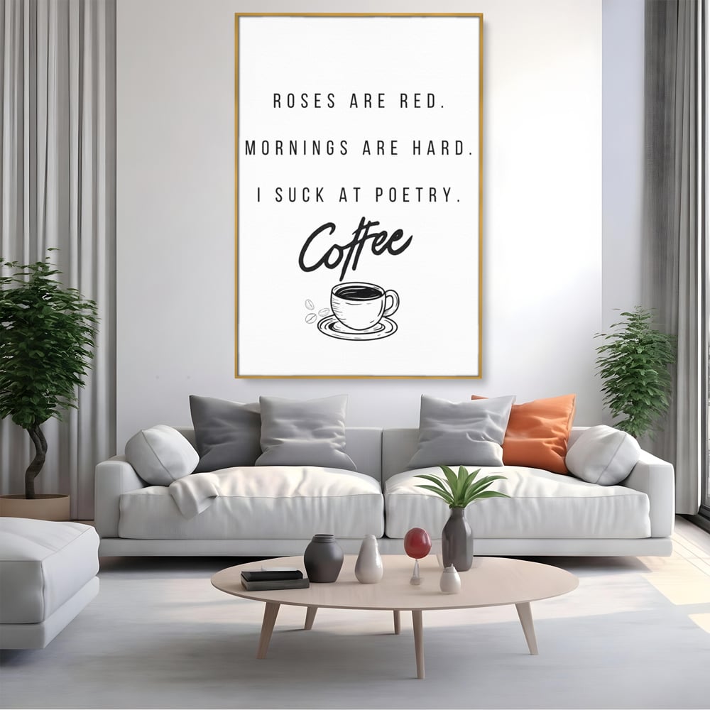Tablou canvas cu tablou canvas cu text humoristic despre cafea, in rama de aluminiu auriu, pe perete intr-un living