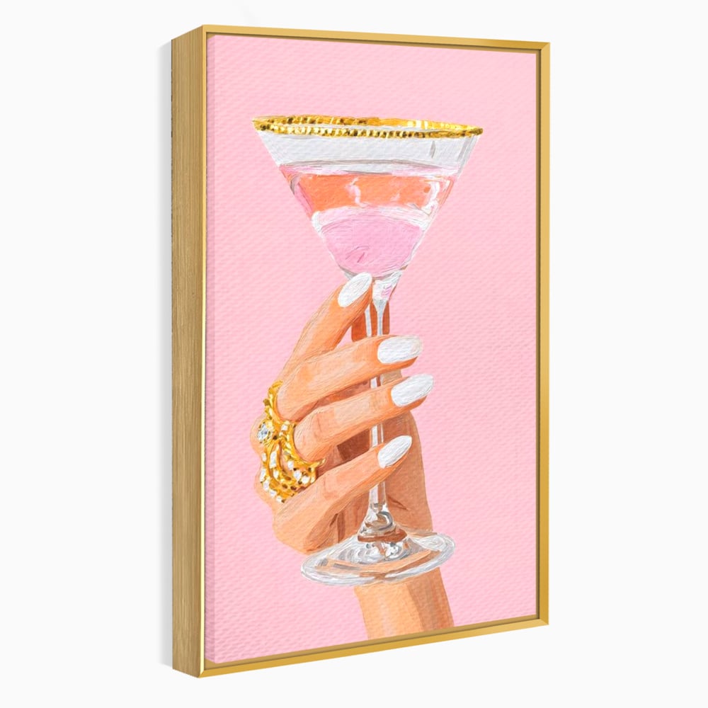Tablou canvas cu ilustratie cu mana care tine pahar de cocktail, in rama de aluminiu auriu