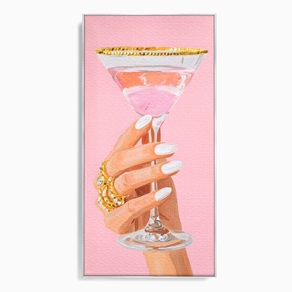 Tablou canvas cu ilustratie cu mana care tine pahar de cocktail, in rama de aluminiu argintiu