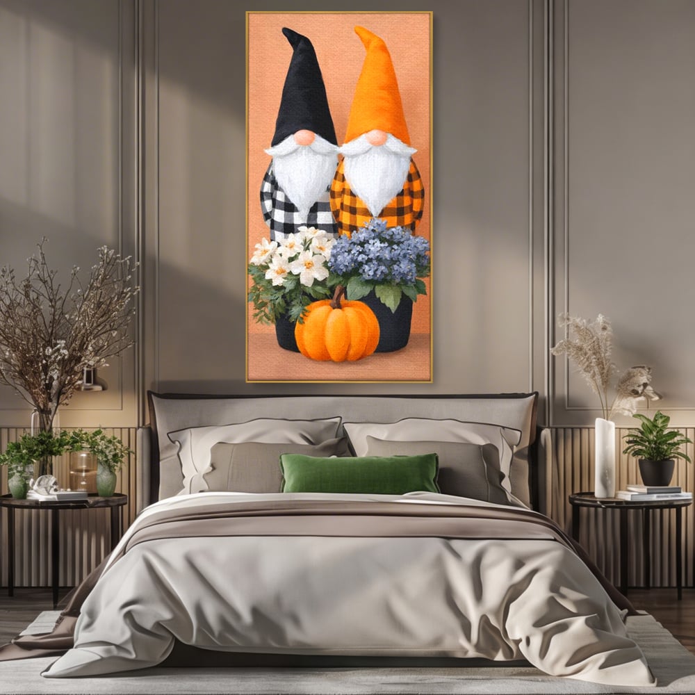 Tablou canvas cu ilustratie cu doi gnomi si dovleac, in rama de aluminiu auriu, pe perete intr-un dormitor
