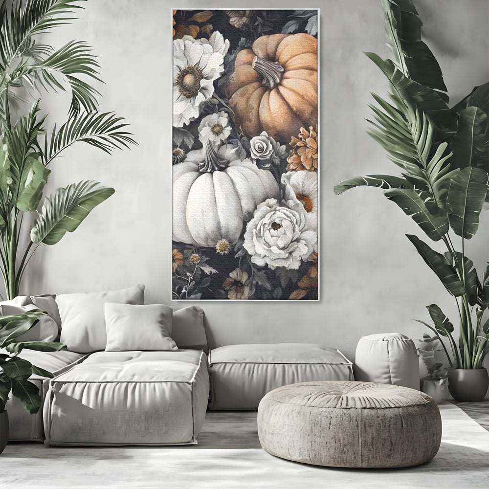 Tablou canvas cu ilustratie cu dovleci si flori de toamna, in rama de aluminiu argintiu, pe perete intr-un living