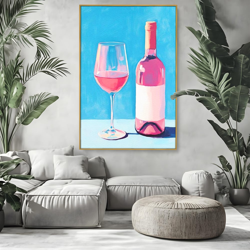 Tablou canvas cu pictura cu sticla de vin rose si pahar, in rama de aluminiu auriu, pe perete intr-un living