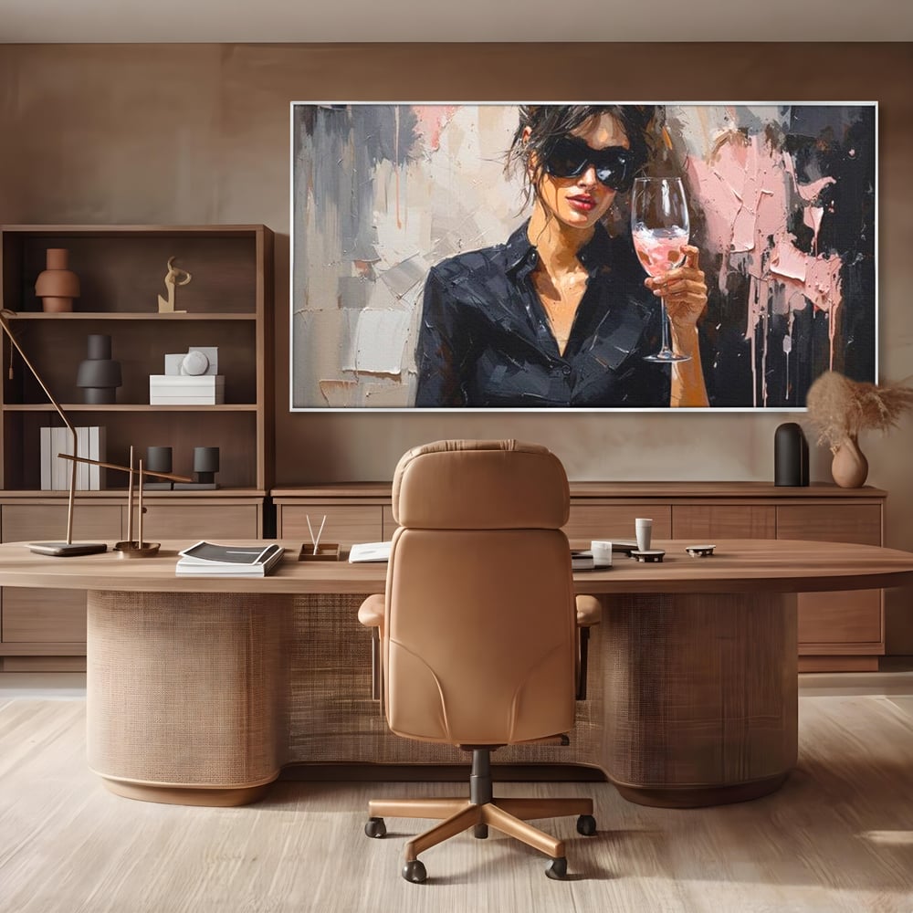 Tablou canvas cu tablou canvas cu femeie si pahar de vin, in rama de aluminiu argintiu, pe perete intr-un birou