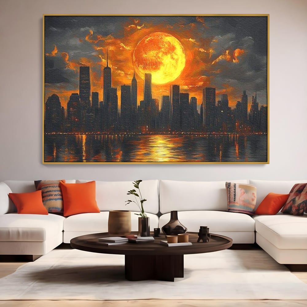 Tablou canvas cu tablou canvas cu apus de soare deasupra metropolei, in rama de aluminiu auriu, pe perete intr-un living