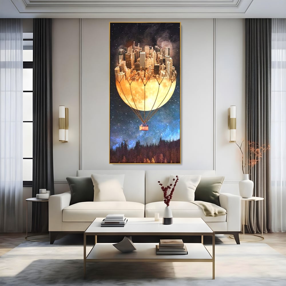 Tablou canvas cu ilustratie cu oras pe luna balon, in rama de aluminiu auriu, pe perete intr-un living