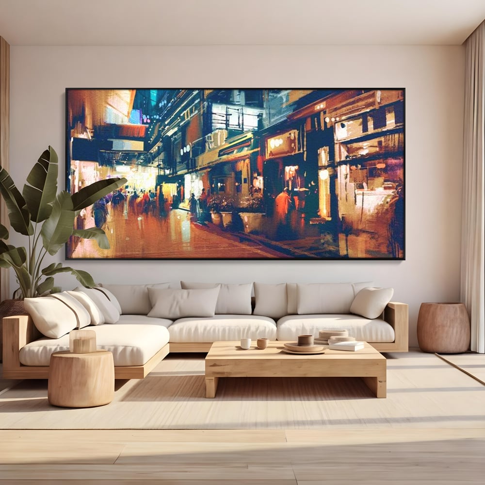 Tablou canvas cu pictura urbana cu strada luminata noaptea, in rama de aluminiu negru, pe perete intr-un living