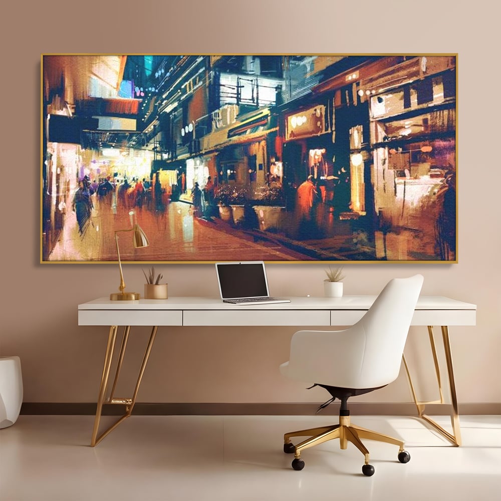 Tablou canvas cu pictura urbana cu strada luminata noaptea, in rama de aluminiu auriu, pe perete intr-un birou