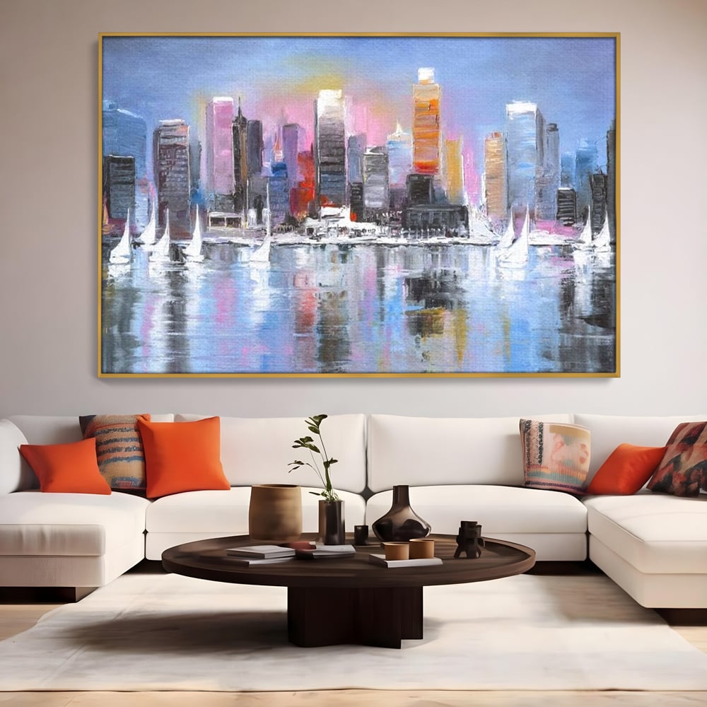 Tablou canvas cu pictura peisaj urban cu vele pe apa, in rama de aluminiu auriu, pe perete intr-un living