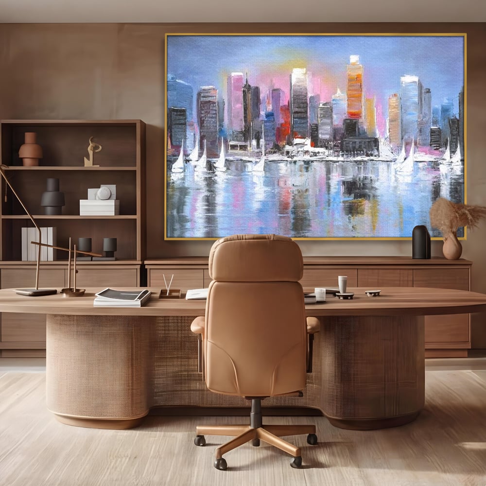Tablou canvas cu pictura peisaj urban cu vele pe apa, in rama de aluminiu auriu, pe perete intr-un birou