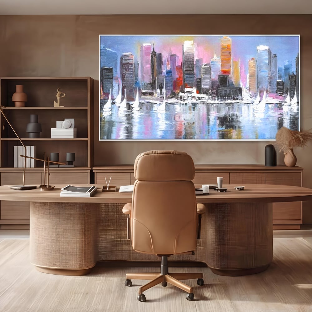 Tablou canvas cu pictura peisaj urban cu vele pe apa, in rama de aluminiu argintiu, pe perete intr-un birou