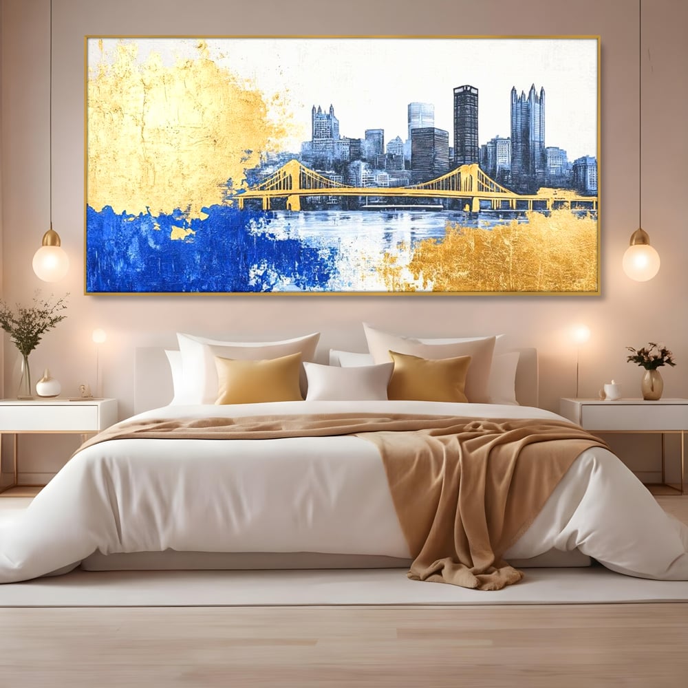 Tablou canvas cu tablou canvas cu peisaj urban si pod, in rama de aluminiu auriu, pe perete intr-un dormitor