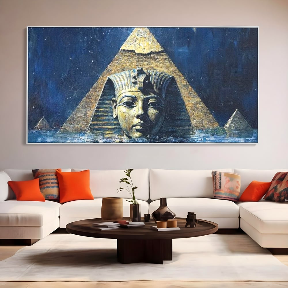 Tablou canvas cu pictura cu sfinx si piramida in apa, in rama de aluminiu argintiu, pe perete intr-un living